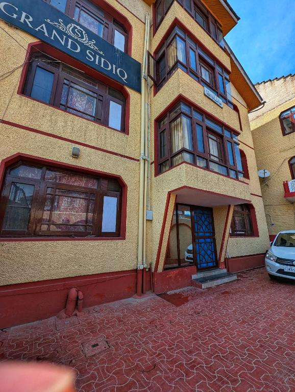 a building with a sign on the side of it at Guest house in srinagar kashmir in Srinagar