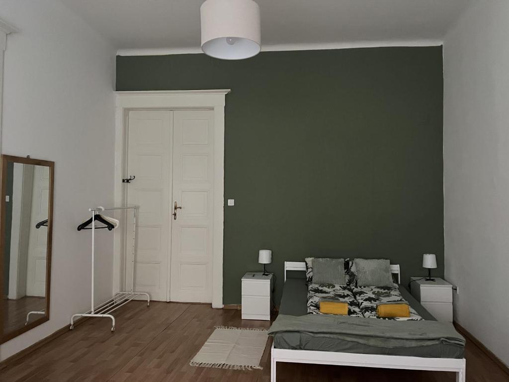 A bed or beds in a room at Palace district rooms
