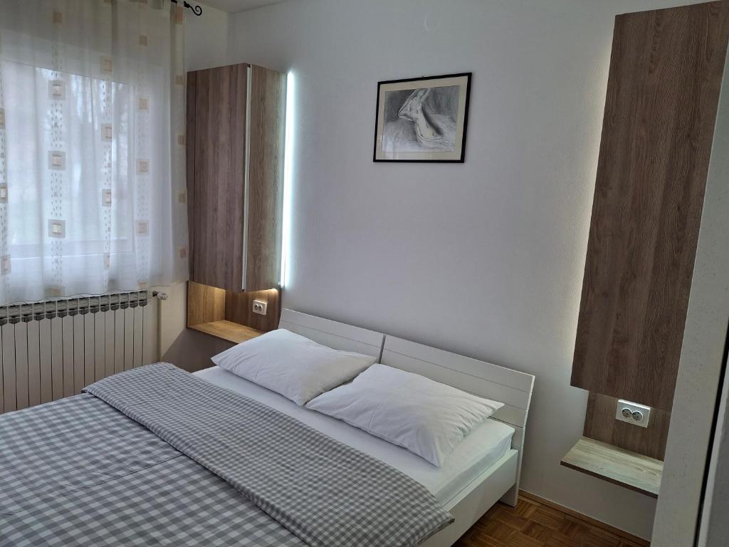 Posteľ alebo postele v izbe v ubytovaní Guest House Kosec