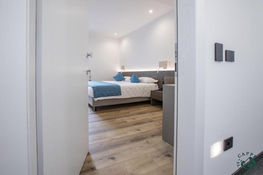 Voodi või voodid majutusasutuse Albergo Cappello e Cadore toas
