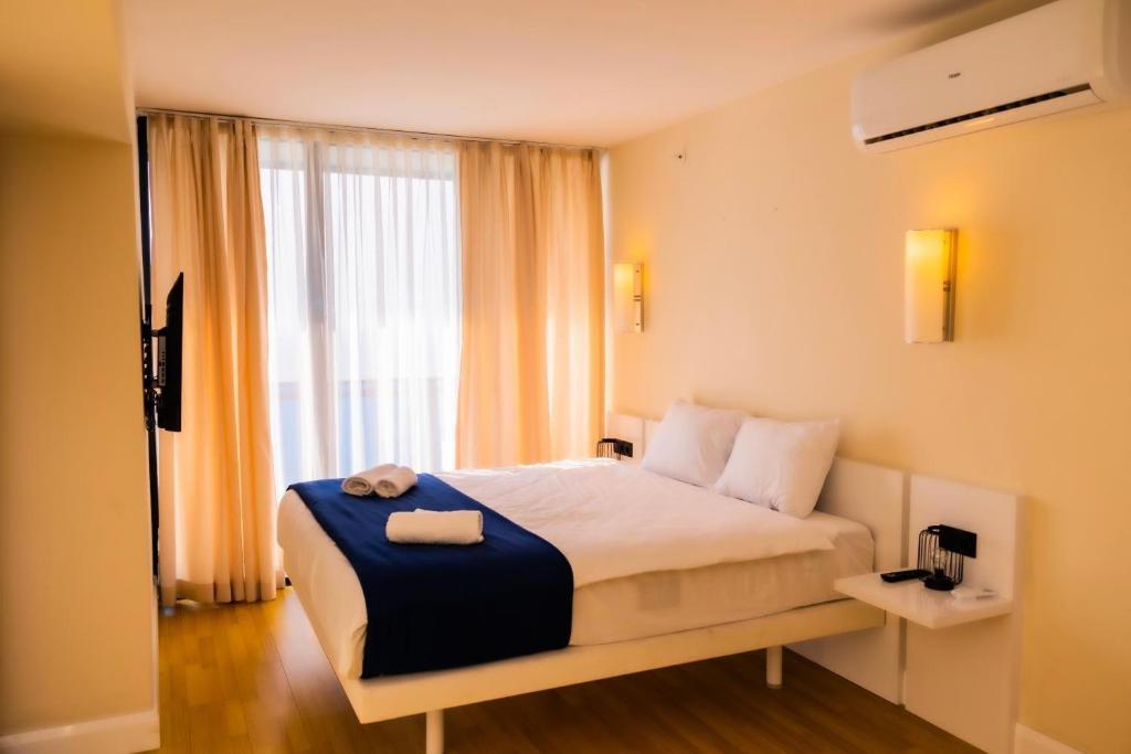 Postel nebo postele na pokoji v ubytování VIP ORBI CITY batumi