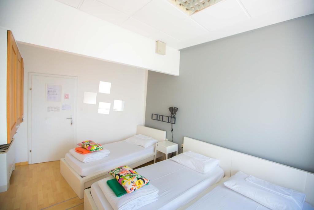 Posteľ alebo postele v izbe v ubytovaní Hostel Kosy