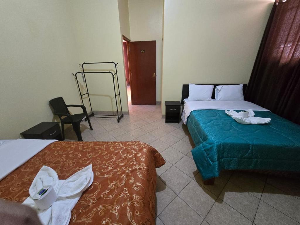 Postel nebo postele na pokoji v ubytování HOSPEDAJE DONA Ayacucho