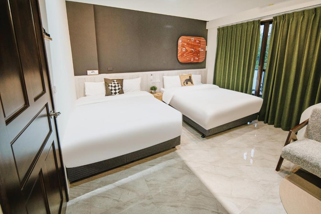 Postel nebo postele na pokoji v ubytování Shishi Homestay