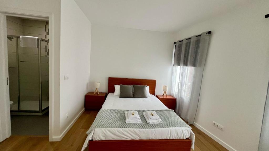 En eller flere senge i et værelse på Amazing Blue House