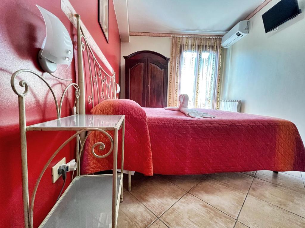 Postel nebo postele na pokoji v ubytování B&B Epos Acitrezza