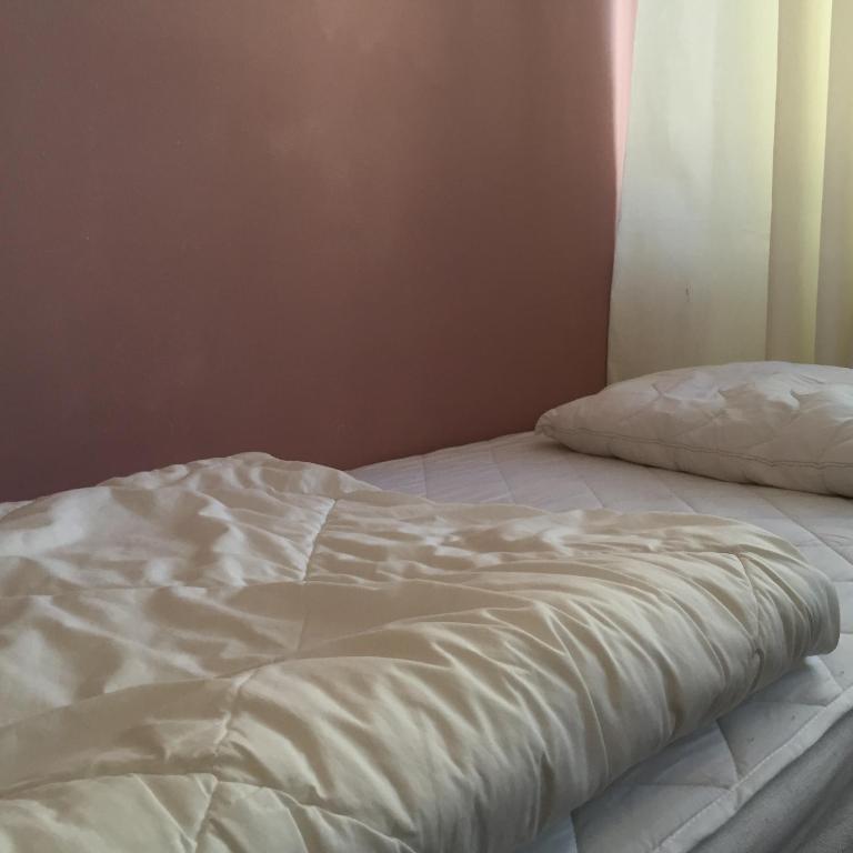 Postel nebo postele na pokoji v ubytování Linné Hostel