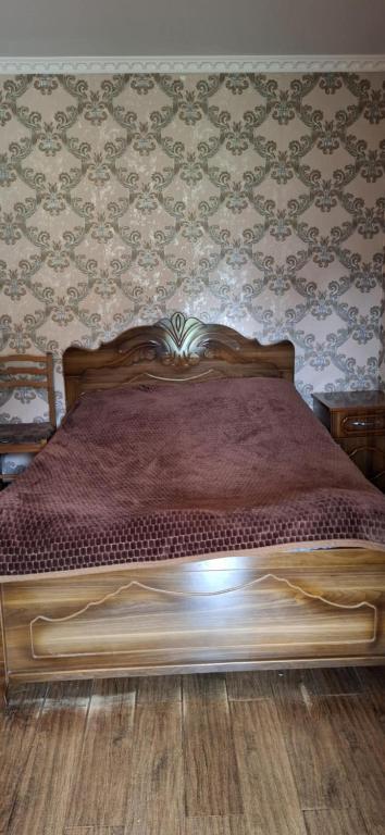 Postel nebo postele na pokoji v ubytování Valodia Guest House In Mestia