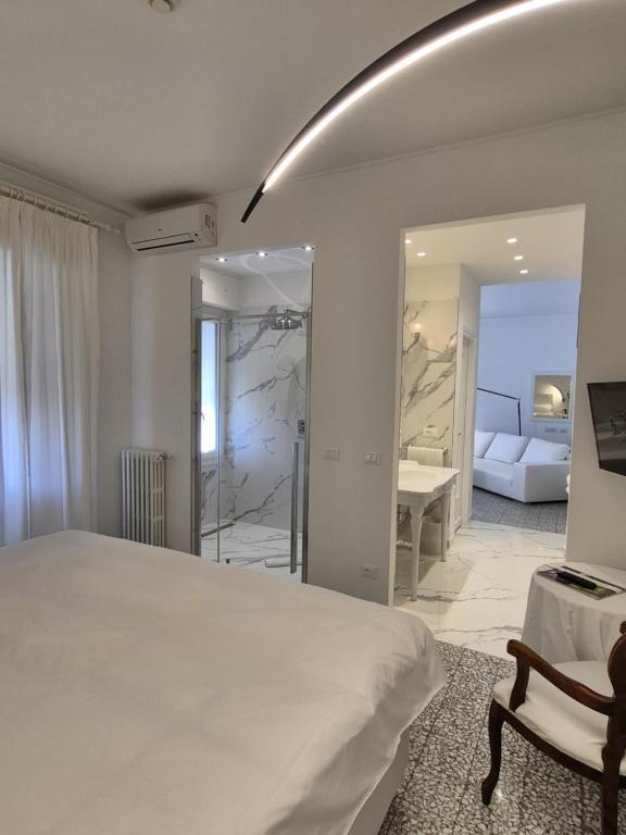 Postel nebo postele na pokoji v ubytování Eveline 2 - Piscina Privata o Jacuzzi