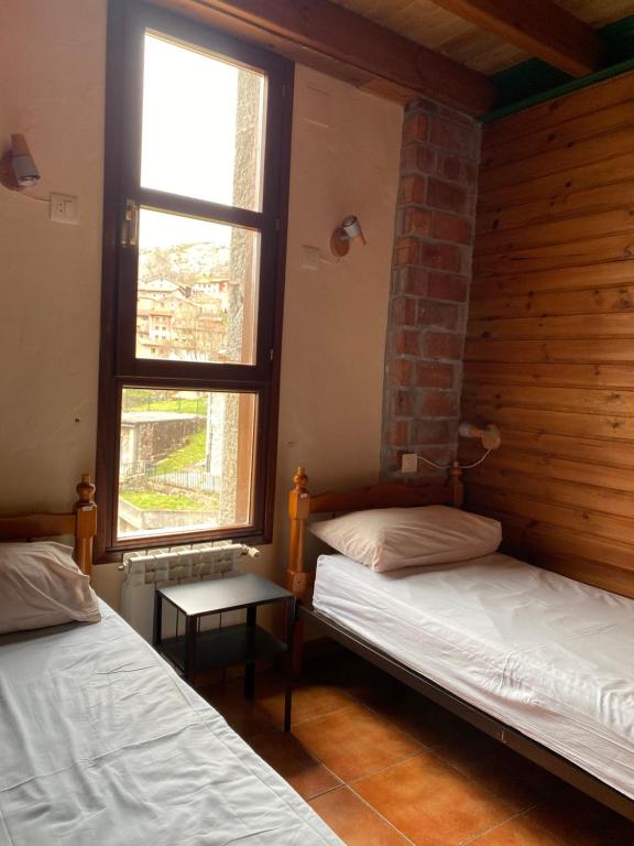 Postel nebo postele na pokoji v ubytování Albergue Peña Castil