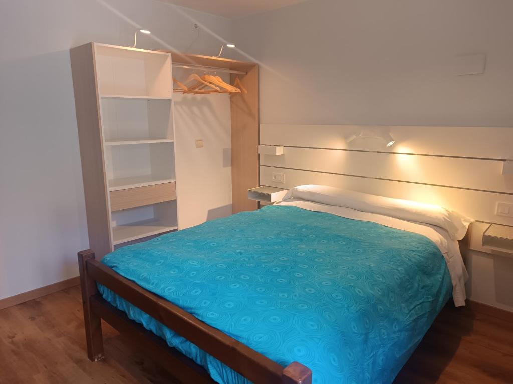 Postel nebo postele na pokoji v ubytování Mora de Nuei
