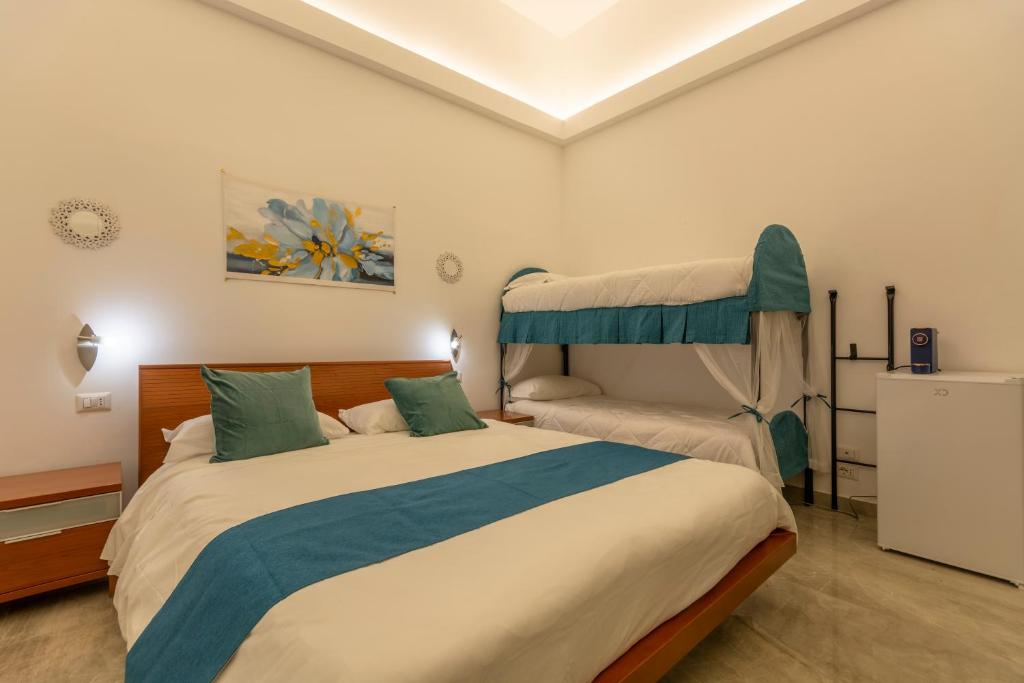 Кровать или кровати в номере Urban Beach Sirena