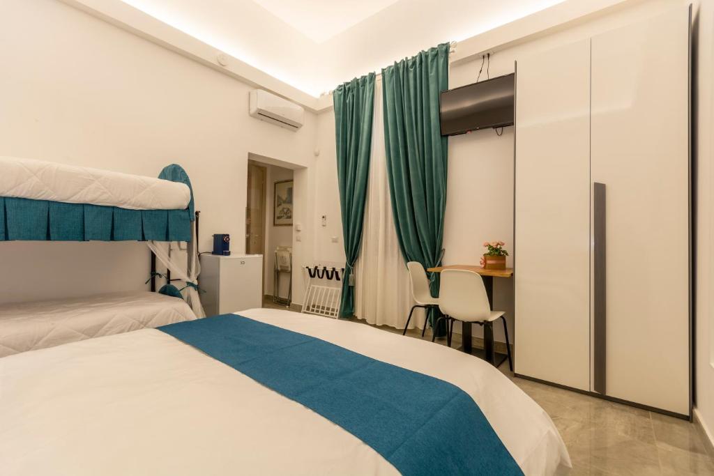 Кровать или кровати в номере Urban Beach Sirena