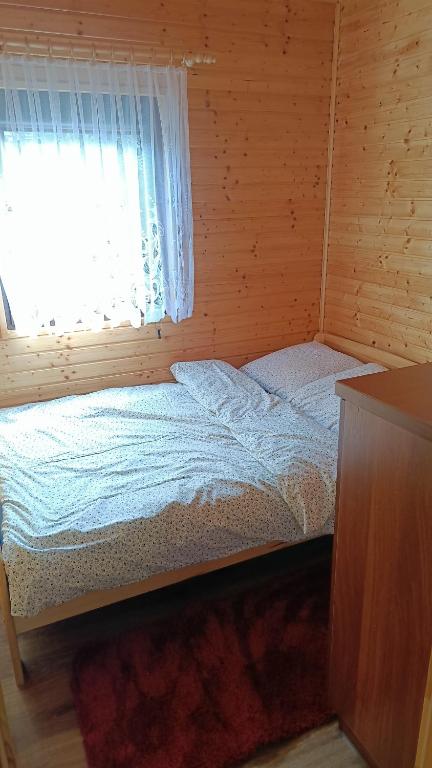 Postel nebo postele na pokoji v ubytování Ośrodek Wypoczynkowy "Słoneczko"
