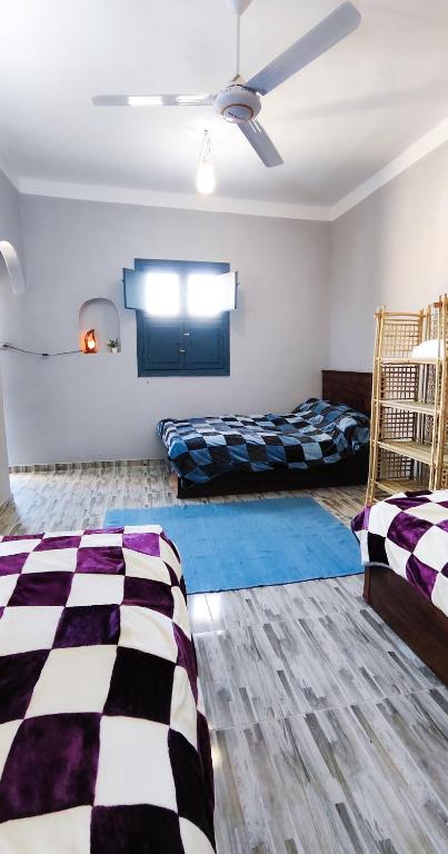 Postel nebo postele na pokoji v ubytování Laila's Home