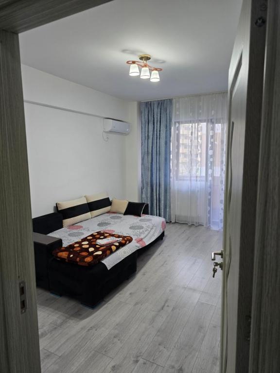 Ένα ή περισσότερα κρεβάτια σε δωμάτιο στο Apartament edy