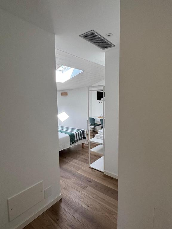 Letto o letti in una camera di BiancoGelso b&b Vegan