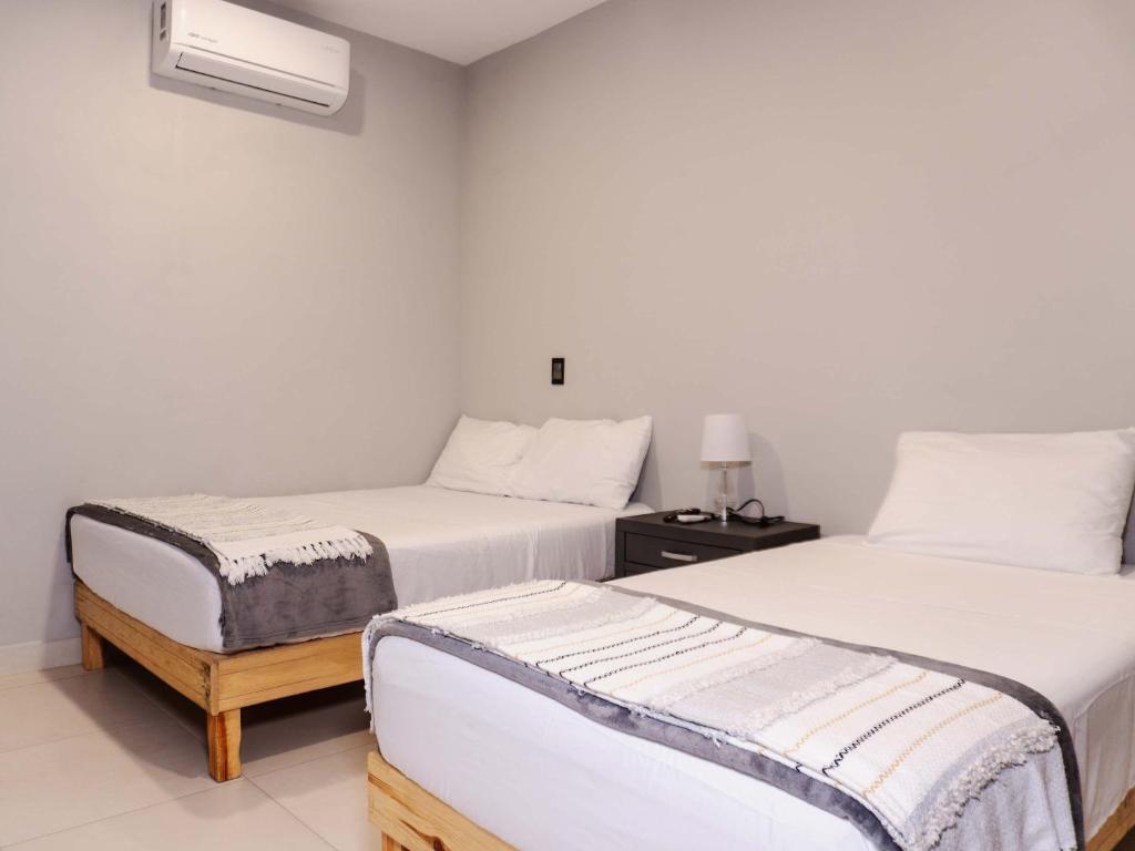 Postel nebo postele na pokoji v ubytování Depa para 6 con alberca en roof - Perlas 9