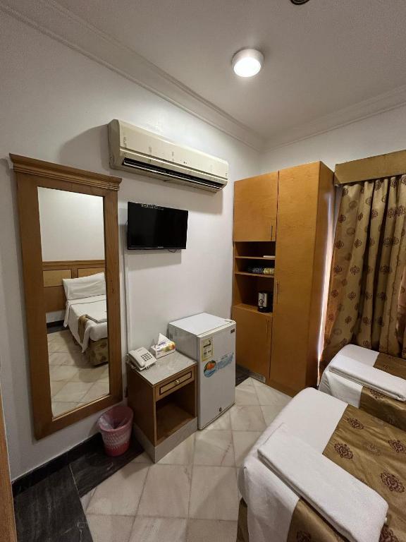 Postel nebo postele na pokoji v ubytování Hamad Saif Batal Hotel
