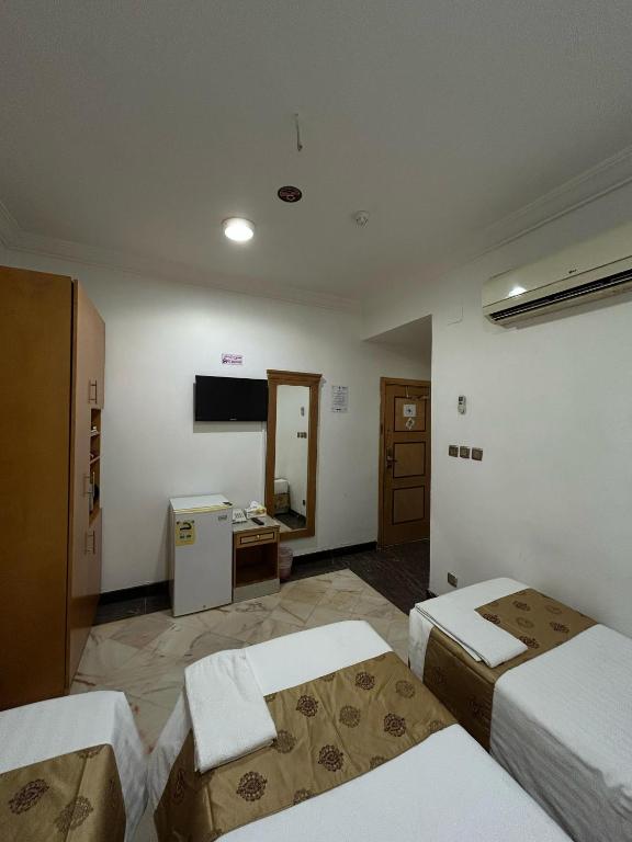 Postel nebo postele na pokoji v ubytování Hamad Saif Batal Hotel