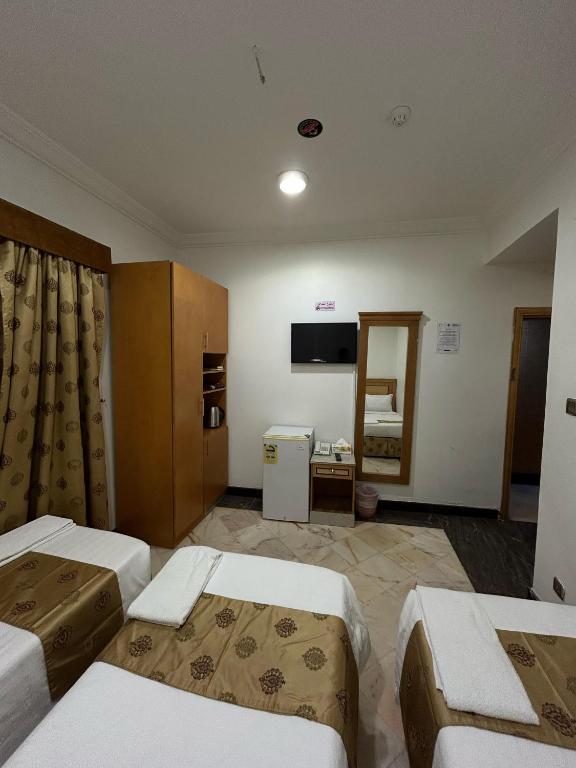 Postel nebo postele na pokoji v ubytování Hamad Saif Batal Hotel