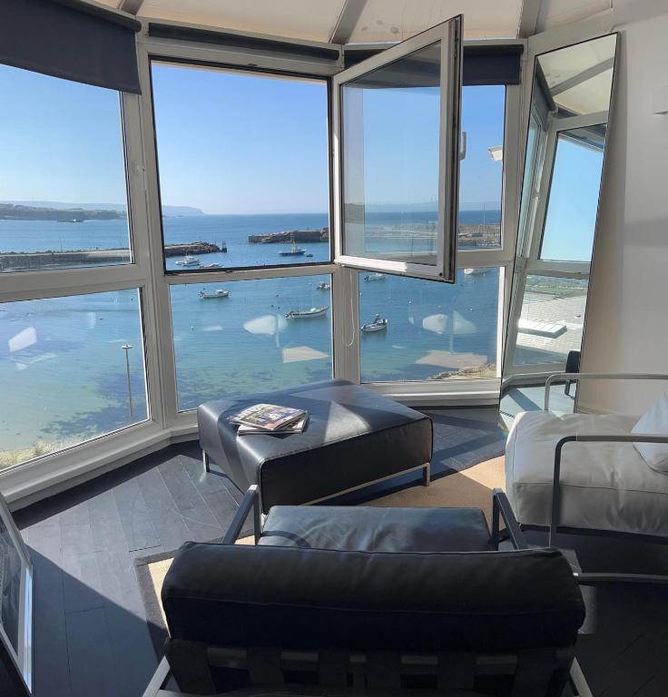 a living room with a view of the ocean at Seaside in Portrush