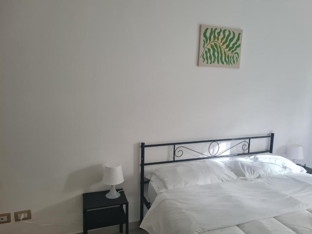 Postel nebo postele na pokoji v ubytování Fiordalisi home