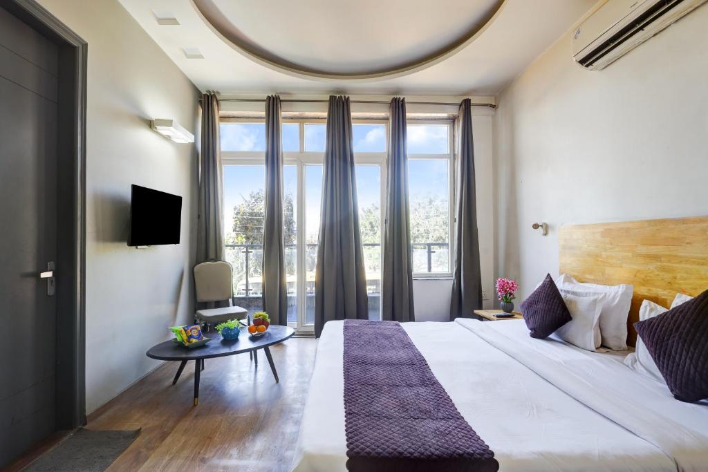 Postel nebo postele na pokoji v ubytování Hotel Wedlock Premium Huda City