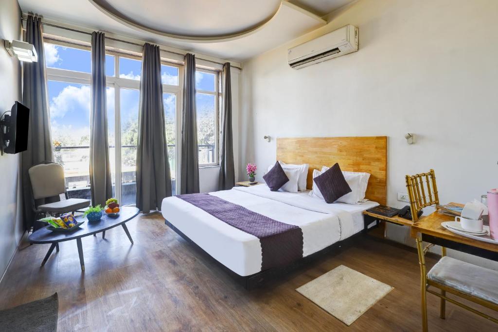 Postel nebo postele na pokoji v ubytování Hotel Wedlock Premium Huda City