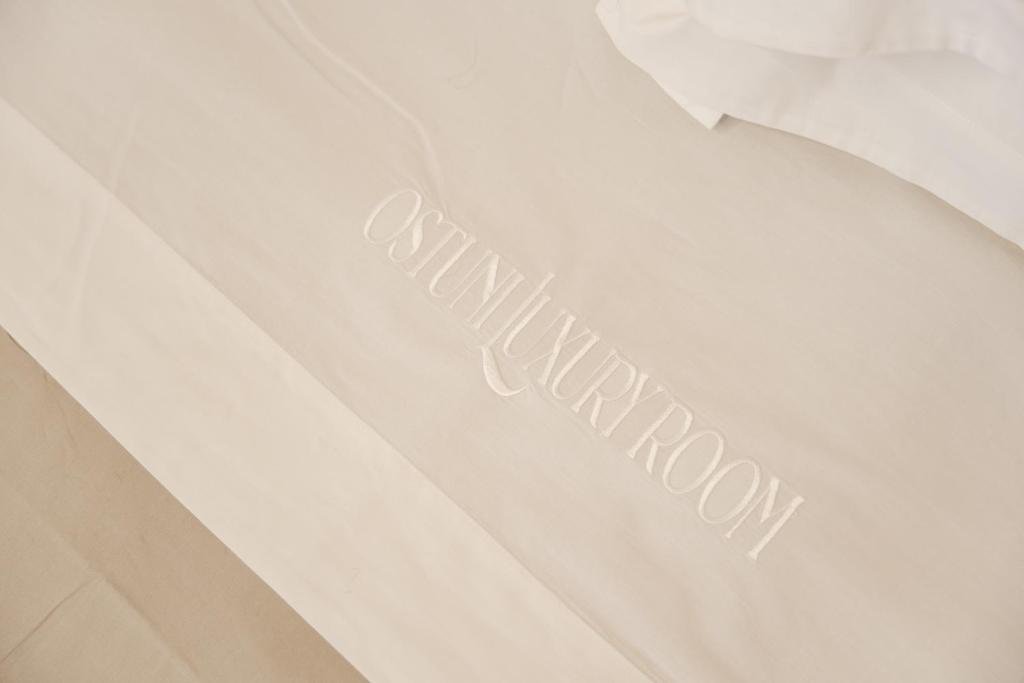Postel nebo postele na pokoji v ubytování Ostuni Luxury Room