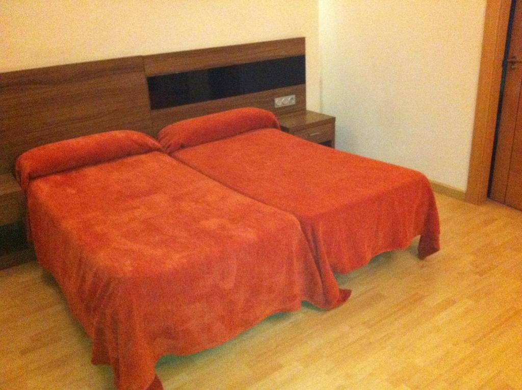 Postel nebo postele na pokoji v ubytování Hotel El Cruce Moraleda
