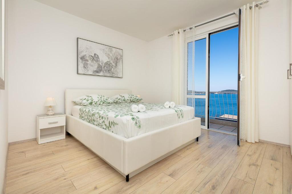Posteľ alebo postele v izbe v ubytovaní Apartment Ela