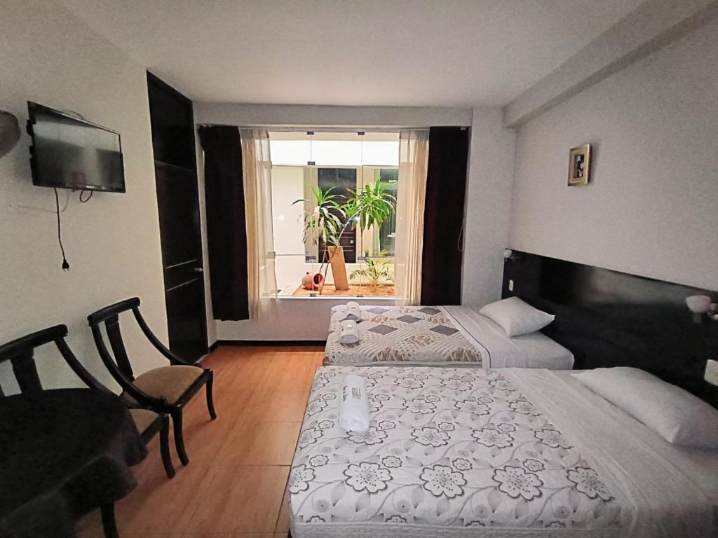 Postel nebo postele na pokoji v ubytování La Lisera Suite Residencial
