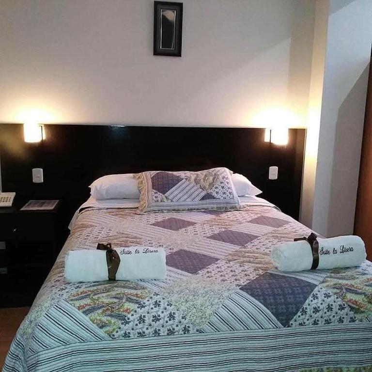 Postel nebo postele na pokoji v ubytování La Lisera Suite Residencial