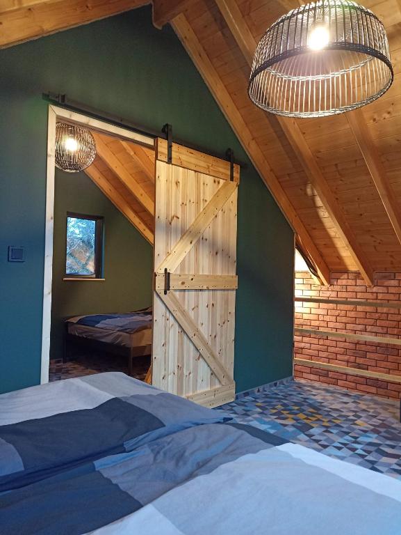 Posteľ alebo postele v izbe v ubytovaní Maraśka Holiday House