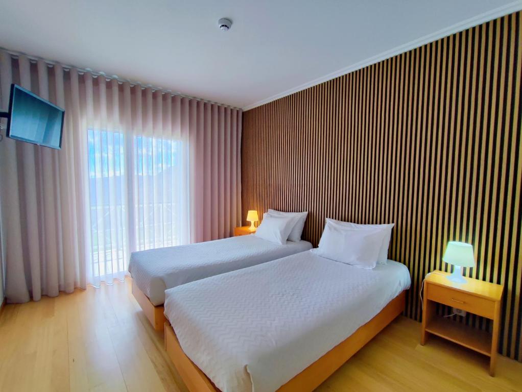 Postel nebo postele na pokoji v ubytování Hotel Miracastro
