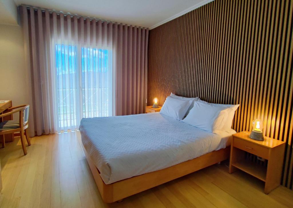 Postel nebo postele na pokoji v ubytování Hotel Miracastro