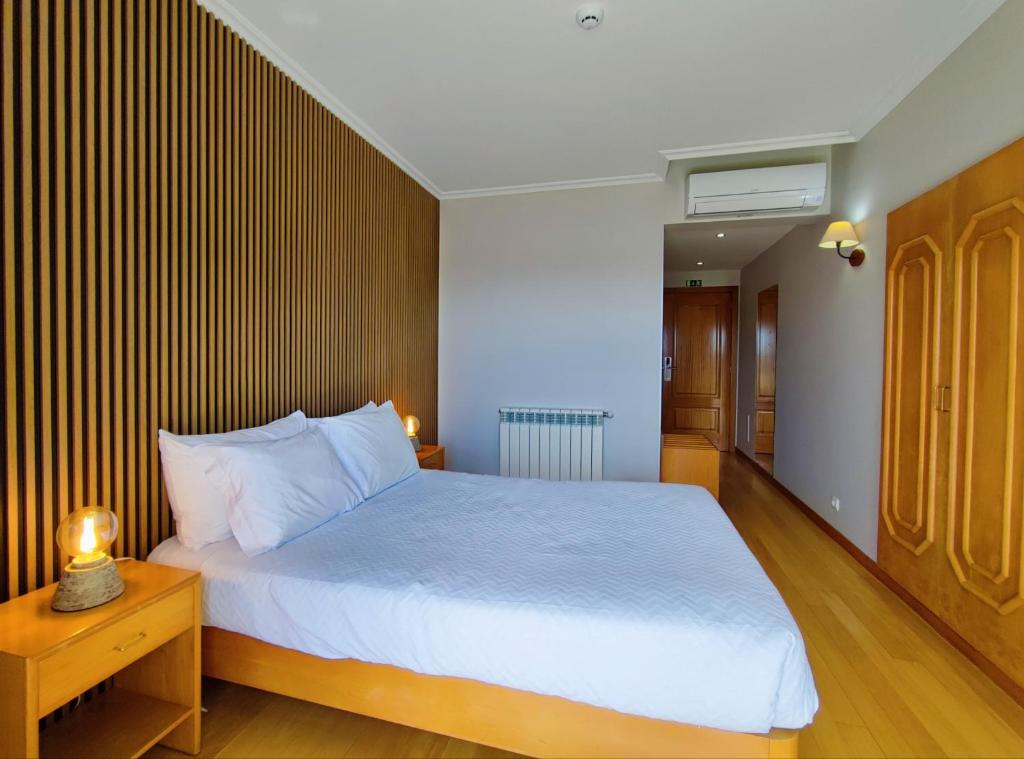 Postel nebo postele na pokoji v ubytování Hotel Miracastro