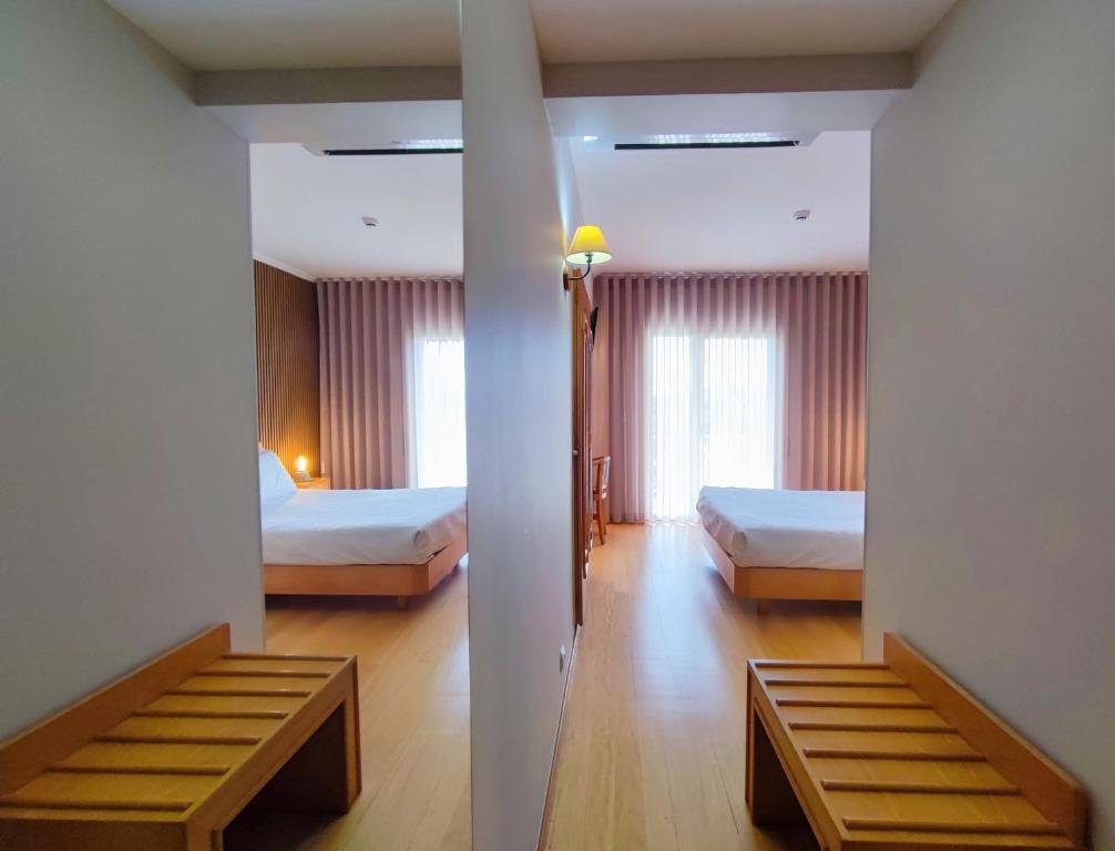 Postel nebo postele na pokoji v ubytování Hotel Miracastro