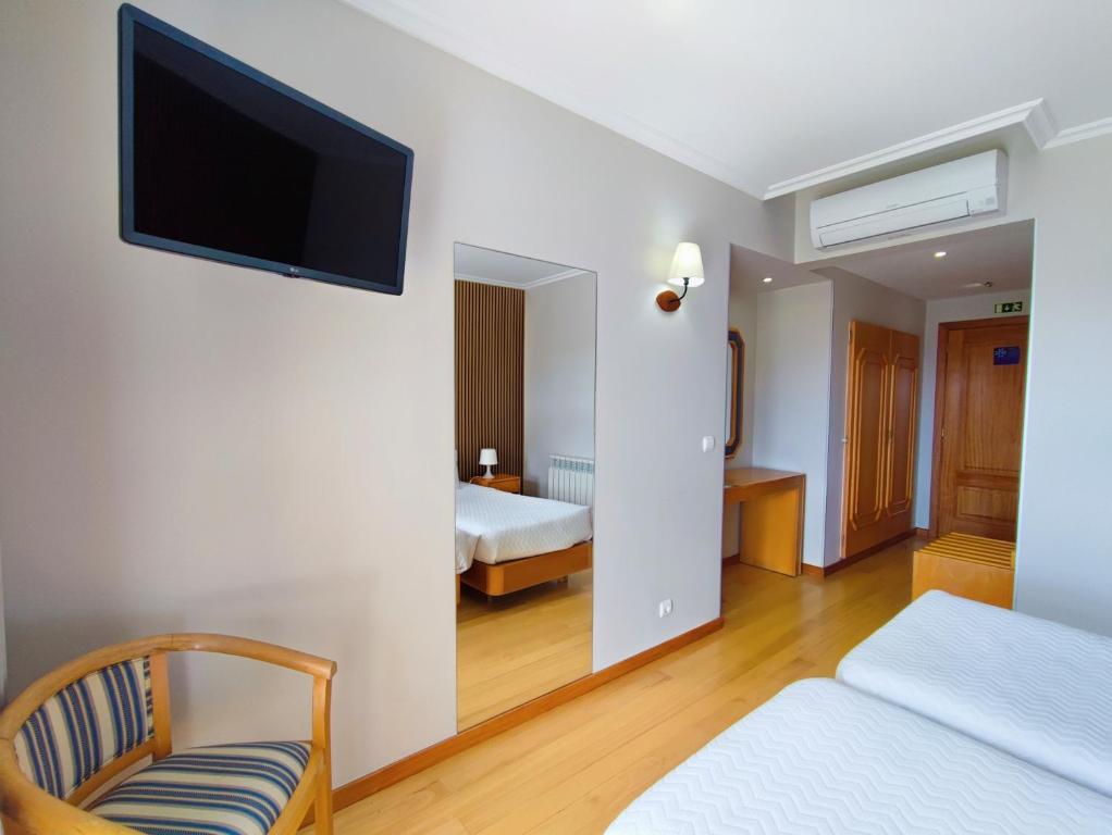 Postel nebo postele na pokoji v ubytování Hotel Miracastro