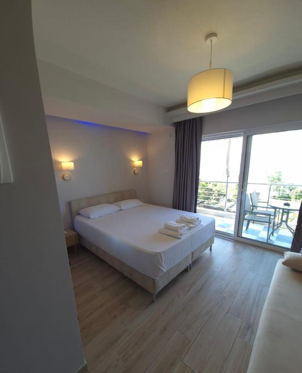 Postel nebo postele na pokoji v ubytování Nikolaidis Apartments