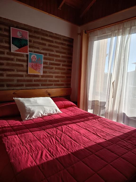 Postel nebo postele na pokoji v ubytování Hostal Julia