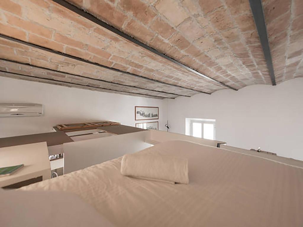 Posteľ alebo postele v izbe v ubytovaní Over The Tiber Loft