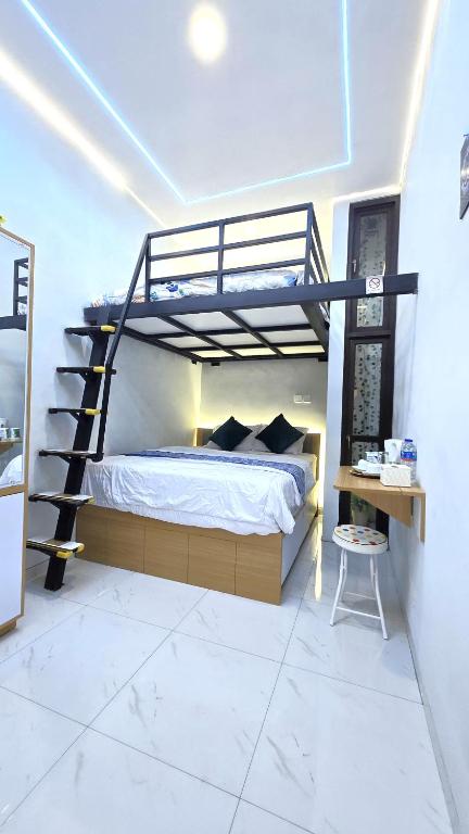 Postel nebo postele na pokoji v ubytování Laswi Syariah Guest House