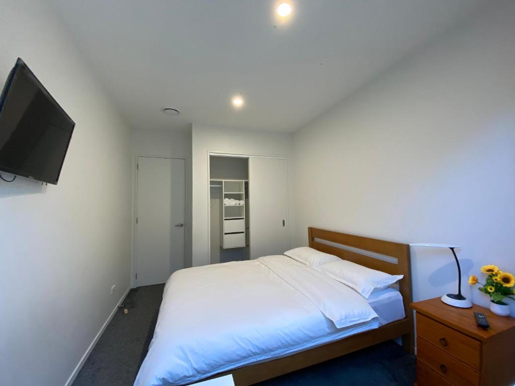 Postel nebo postele na pokoji v ubytování CozyNest2
