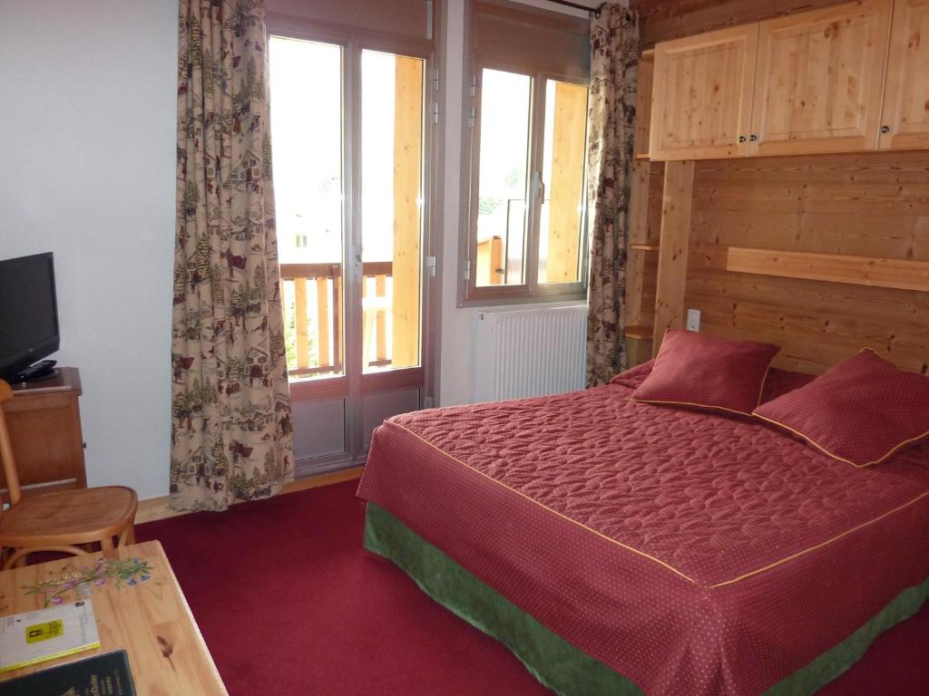 Postel nebo postele na pokoji v ubytování Hôtel Le Grand-Bec