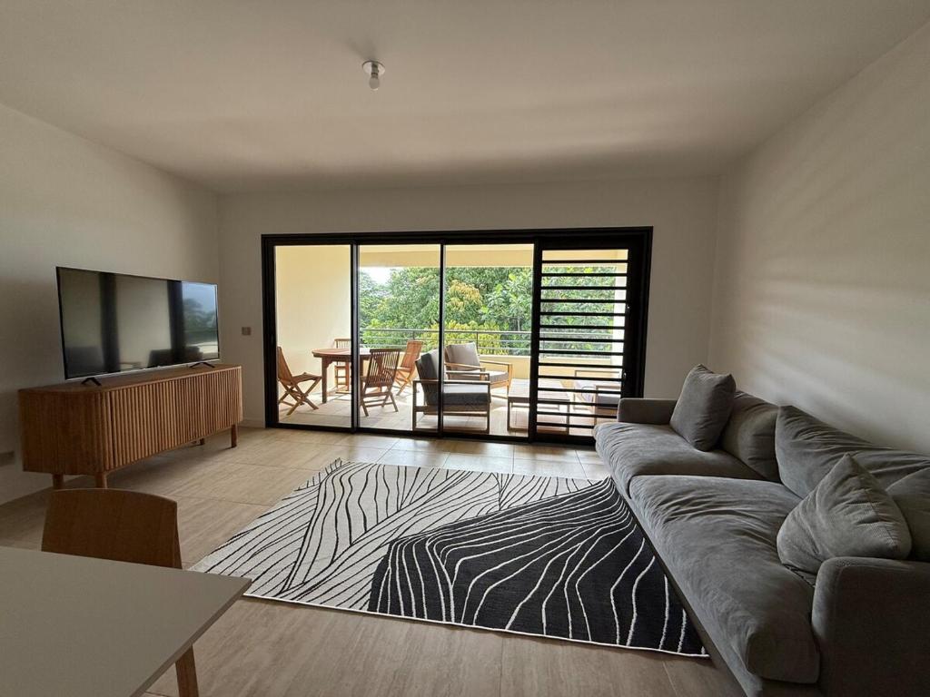 TV o dispositivi per l'intrattenimento presso Arbre a pain Beach Lodge