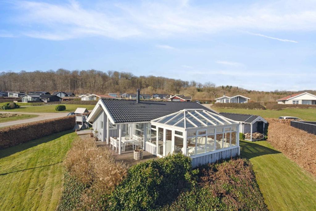 an overhead view of a greenhouse in a yard at Lovely Summer House With Sea View in Sjølund