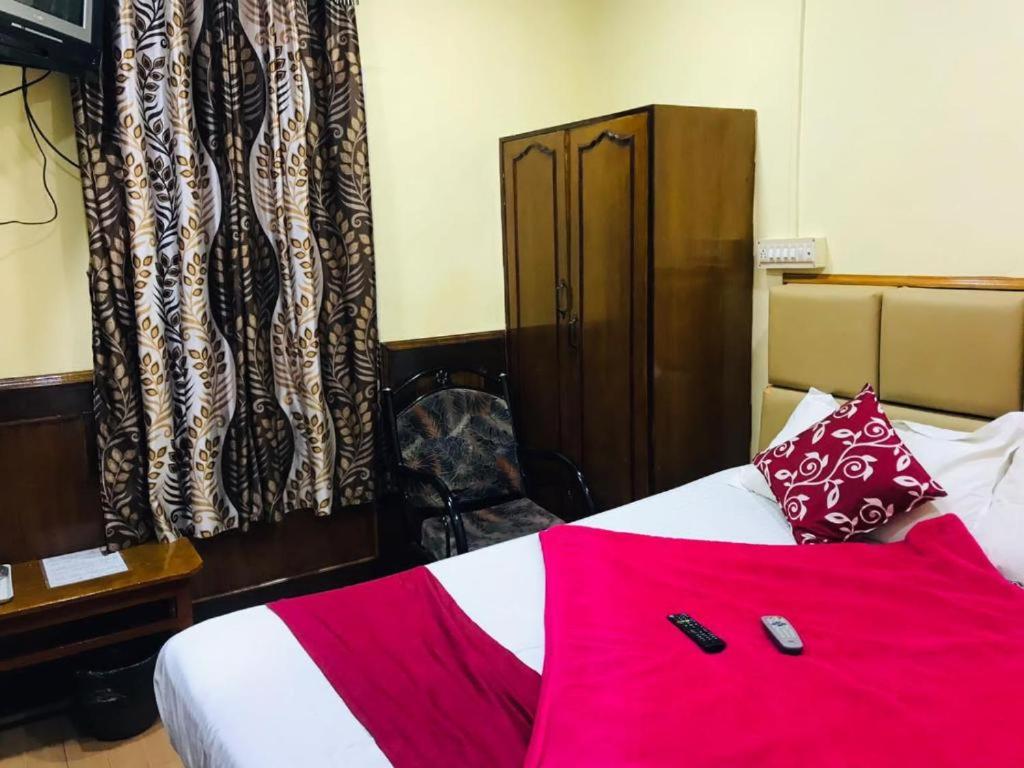 Postel nebo postele na pokoji v ubytování Hotel mystique inn