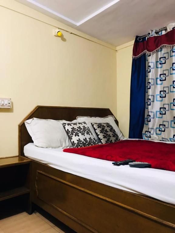 Postel nebo postele na pokoji v ubytování Hotel mystique inn